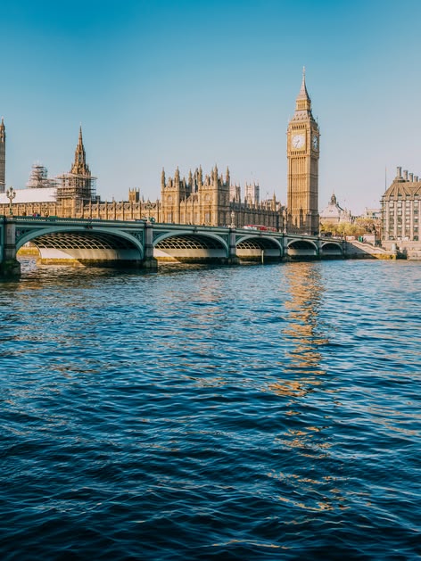 View of the River Thames with Westminster Bridge and the Houses of Parliament in London, UK.